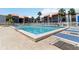 Resort-style swimming pool offering a refreshing oasis with ample seating and beautiful views of the surrounding condos at 3269 Beneva Rd # 103, Sarasota, FL 34232