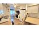 Efficient kitchen layout with essential appliances and a breakfast table area for casual dining at 3308 Oakwood S Blvd, Sarasota, FL 34237