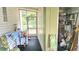 Patio with washer, dryer and storage, providing an area for household chores and convenience at 3308 Oakwood S Blvd, Sarasota, FL 34237