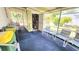 Spacious outdoor patio with seating area, shed, screened windows, and ample room for relaxation at 3308 Oakwood S Blvd, Sarasota, FL 34237