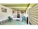Inviting patio with green chairs, perfect for enjoying the outdoors in a relaxed setting at 3308 Oakwood S Blvd, Sarasota, FL 34237