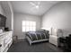 Well-lit bedroom features a comfortable bed, modern ceiling fan and large window with light-filtering shutters at 3803 54Th W Dr # 201, Bradenton, FL 34210