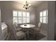Bright dining area with white furniture, a modern chandelier, and natural light, perfect for intimate gatherings at 3803 54Th W Dr # 201, Bradenton, FL 34210