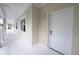 Inviting condo entrance featuring a white front door and neutral tones creating a modern and clean aesthetic at 3803 54Th W Dr # 201, Bradenton, FL 34210