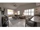 Inviting living room with vaulted ceiling, fan, tile floor, and open access to a dining area at 3803 54Th W Dr # 201, Bradenton, FL 34210
