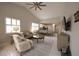 Sunlit living room featuring vaulted ceilings, tile floors, and an open layout connecting to the kitchen at 3803 54Th W Dr # 201, Bradenton, FL 34210