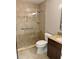 Modern bathroom with large walk-in shower with safety bar and tiled walls at 4037 Crockers Lake Blvd # 14, Sarasota, FL 34238