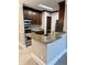 The kitchen has stainless steel appliances, granite counters, tile floor, and dark wood cabinets adding style at 4037 Crockers Lake Blvd # 14, Sarasota, FL 34238