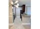 Updated kitchen featuring stainless steel appliances, granite countertops, tile floors, and dark wood cabinets at 4037 Crockers Lake Blvd # 14, Sarasota, FL 34238