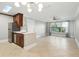 Open concept living and dining area with abundant natural light and bar seating at 4037 Crockers Lake Blvd # 14, Sarasota, FL 34238