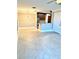 Living space with tile floors leading to a dining area, kitchen, and seating area with large windows and ceiling fan at 4037 Crockers Lake Blvd # 14, Sarasota, FL 34238