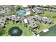 Aerial view showcasing the community's pool, tennis courts, and waterfront location at 4234 Gulf Of Mexico Dr # G2, Longboat Key, FL 34228