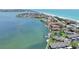 Aerial view of waterfront townhomes with private docks along the bay at 4234 Gulf Of Mexico Dr # G2, Longboat Key, FL 34228