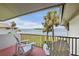 Private balcony offers water views, outdoor seating, and a shade from the sun at 4234 Gulf Of Mexico Dr # G2, Longboat Key, FL 34228