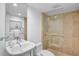 Clean bathroom features glass enclosed shower, modern fixtures, and travertine tile at 4234 Gulf Of Mexico Dr # G2, Longboat Key, FL 34228