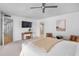 Bright main bedroom featuring a ceiling fan, carpet flooring, and ensuite bathroom at 4234 Gulf Of Mexico Dr # G2, Longboat Key, FL 34228