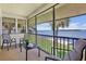 Relaxing screened-in patio offers serene water views and comfortable seating at 4234 Gulf Of Mexico Dr # G2, Longboat Key, FL 34228