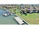 Waterfront condo featuring private dock access, balconies, and lush landscaping at 4234 Gulf Of Mexico Dr # G2, Longboat Key, FL 34228