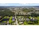 An aerial view shows a beautiful community, lakes, and lush green landscaping at 4402 Natures Reach Ter, Parrish, FL 34219