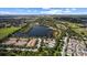 An aerial view shows a beautiful community, lakes, and lush green landscaping at 4402 Natures Reach Ter, Parrish, FL 34219