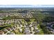 An aerial view shows a beautiful community, lakes, and lush green landscaping at 4402 Natures Reach Ter, Parrish, FL 34219