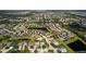 An aerial view shows a beautiful community, lakes, and lush green landscaping at 4402 Natures Reach Ter, Parrish, FL 34219