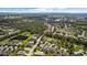 An aerial view shows a beautiful community, lakes, and lush green landscaping at 4402 Natures Reach Ter, Parrish, FL 34219