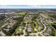 An aerial view shows a beautiful community, lakes, and lush green landscaping at 4402 Natures Reach Ter, Parrish, FL 34219