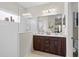 Modern bathroom with a double vanity, glass-enclosed shower, and ample counter space at 4402 Natures Reach Ter, Parrish, FL 34219
