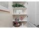 Charming corner shelves displaying decorative items, adding character to the space at 4402 Natures Reach Ter, Parrish, FL 34219