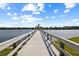 Scenic wooden pier leading to gazebo on lake providing water views at 4402 Natures Reach Ter, Parrish, FL 34219