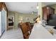 Open kitchen with bar seating overlooking the living area, Primary bedroom, and backyard at 4402 Natures Reach Ter, Parrish, FL 34219