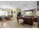 Spacious living room featuring an open layout, dining area, and large windows at 4402 Natures Reach Ter, Parrish, FL 34219
