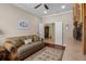 Home office space with a comfortable sofa and a view of the hallway and closet at 4402 Natures Reach Ter, Parrish, FL 34219