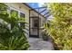 Screened patio with lush tropical foliage and a private outdoor space at 4402 Natures Reach Ter, Parrish, FL 34219