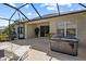 Outdoor patio with a lounge area, hot tub, and screened enclosure at 4402 Natures Reach Ter, Parrish, FL 34219