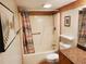 Bathroom with a shower-tub combo and tiled walls at 4607 W North B St # 105, Tampa, FL 33609