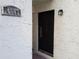 Inviting front entrance with a dark-colored door and house number displayed at 4607 W North B St # 105, Tampa, FL 33609
