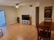 Cozy living room with tile flooring, a ceiling fan, and an open layout at 4607 W North B St # 105, Tampa, FL 33609