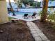 Community pool with loungers and landscaping at 4607 W North B St # 105, Tampa, FL 33609