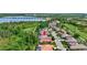 An aerial view of a charming community offering tree lined streets, golf course, and nearby lake at 4818 88Th E St, Bradenton, FL 34211