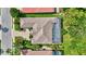 An aerial view of the back of the home with a screened in pool, and a well manicured yard at 4818 88Th E St, Bradenton, FL 34211