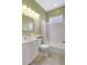 Bathroom featuring a shower-tub combo and large vanity at 4818 88Th E St, Bradenton, FL 34211