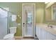 Bathroom with a door to the outdoor patio at 4818 88Th E St, Bradenton, FL 34211