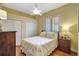 Bright bedroom features a window with blinds and two closets at 4818 88Th E St, Bradenton, FL 34211
