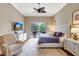 Relaxing bedroom with a ceiling fan and sliding glass door to the patio at 4818 88Th E St, Bradenton, FL 34211