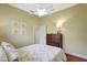 Comfortable bedroom featuring a ceiling fan and a window at 4818 88Th E St, Bradenton, FL 34211