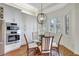 Cozy dining area with a glass table, shuttered windows, and modern lighting at 4818 88Th E St, Bradenton, FL 34211