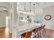 Stylish kitchen featuring a large island with bar seating and pendant lighting at 4818 88Th E St, Bradenton, FL 34211