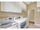 Spacious laundry room featuring modern washer and dryer units at 4818 88Th E St, Bradenton, FL 34211